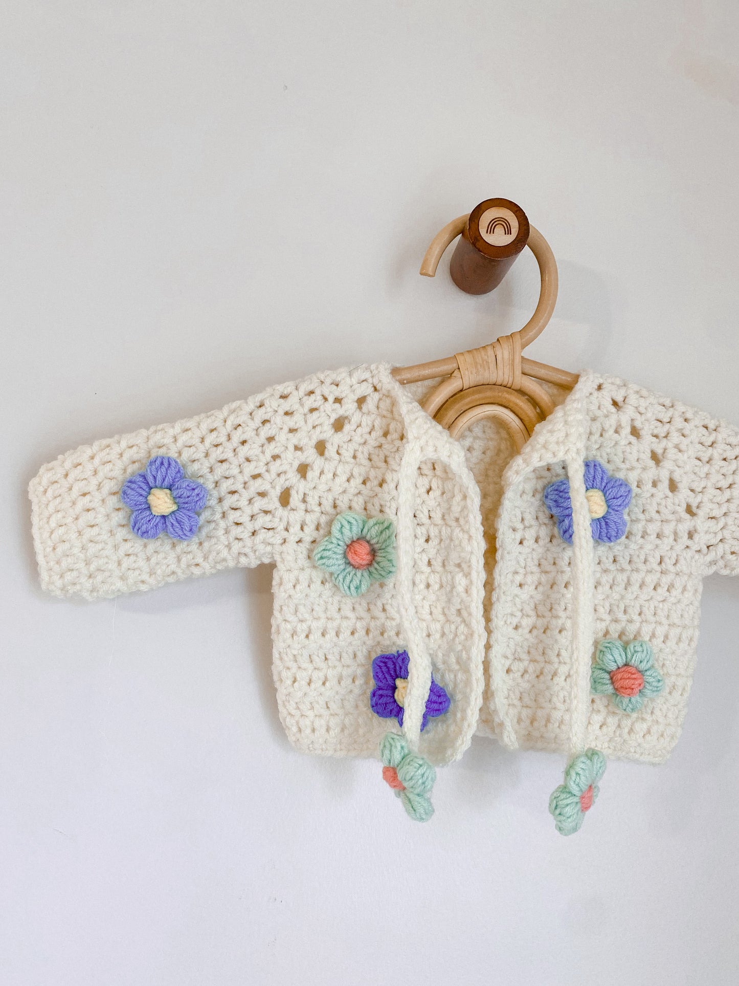 Cardigans with crocheted flowers