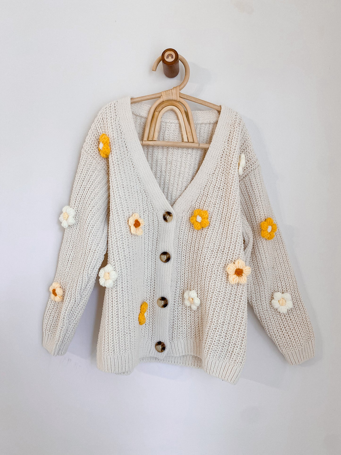 Cardigans with crocheted flowers
